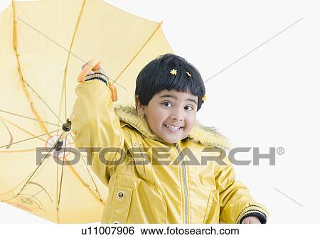 Portrait of a girl throwing an umbrella View Large Photo Image Stock Photograph - Portrait of a girl throwing an umbrella. Fotosearch