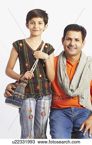 Portrait of a mature man sitting with his daughter and smiling View Large Photo Image Stock Image - Portrait of a mature man sitting with his daughter and smiling. Fotosearch
