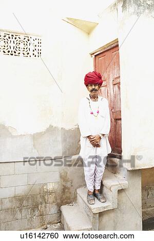 Portrait of a mature man standing in front of a door View Large Photo Image Stock Image - Portrait of a mature man standing in front of a door. Fotosearch
