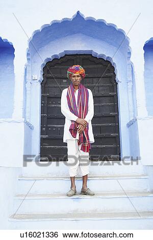 Portrait of a mid adult man standing on the steps of a building, Pushkar, Rajasthan, India View Large Photo Image Stock Photograph - Portrait of a mid adult man standing on the steps of a building, Pushkar, Rajasthan, India. Fotosearch