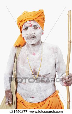 Portrait of a sadhu holding a cane View Large Photo Image Stock Photo - Portrait of a sadhu holding a cane. Fotosearch