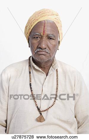 Stock Photo - Portrait of a sadhu looking serious. Fotosearch