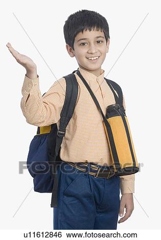 Portrait of a schoolboy waving his hand View Large Photo Image Stock Photograph - Portrait of a schoolboy waving his hand. Fotosearch