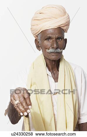 Portrait of a senior man holding a cane View Large Photo Image Stock Photo - Portrait of a senior man holding a cane. Fotosearch