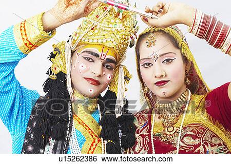 Stock Photograph - Portrait of a teenage girl and a young man performing Raasleela. Fotosearch