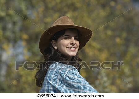 Stock Image - Portrait of a teenage girl smiling. Fotosearch