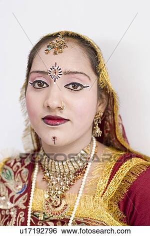 Stock Photograph - Portrait of a teenage girl wearing traditional clothes. Fotosearch