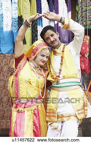 Stock Image - Portrait of a young couple performing Raasleela. Fotosearch