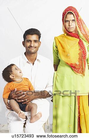 Stock Image - Portrait of a young couple with their son. Fotosearch