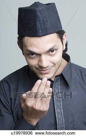 Stock Photograph - Portrait of a young man greeting. Fotosearch