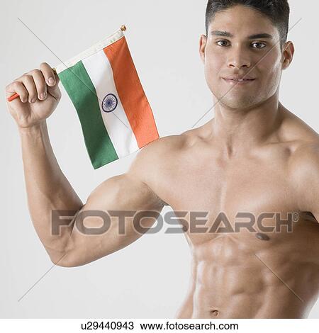 Portrait of a young man holding the Indian flag View Large Photo Image Stock Image - Portrait of a young man holding the Indian flag. Fotosearch