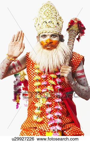 Stock Photograph - Portrait of a young man in a traditional clothing. Fotosearch