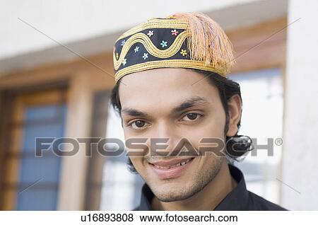Portrait of a young man smiling View Large Photo Image Stock Photo - Portrait of a young man smiling. Fotosearch