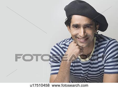 Portrait of a young man smiling View Large Photo Image Stock Photo - Portrait of a young man smiling. Fotosearch
