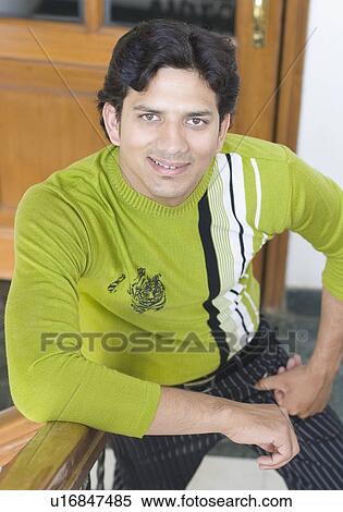 Stock Photography - Portrait of a young man smiling. Fotosearch