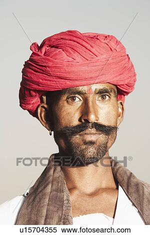 Portrait of a young man wearing a turban View Large Photo Image Stock Photography - Portrait of a young man wearing a turban. Fotosearch