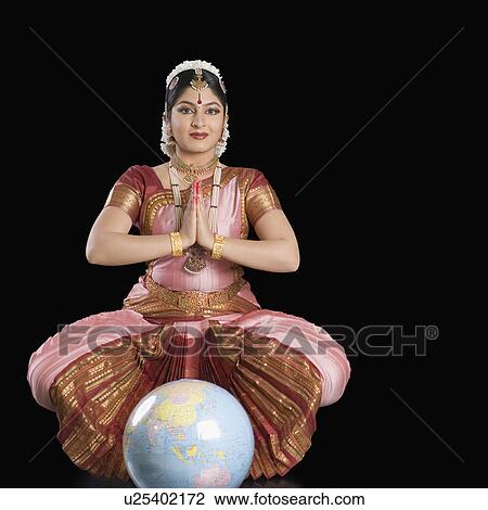 Stock Image - Portrait of a young woman performing Bharatnatyam. Fotosearch