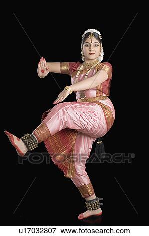 Stock Photo - Portrait of a young woman performing Bharatnatyam. Fotosearch