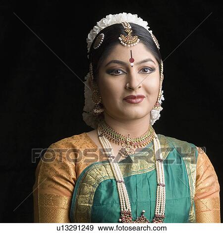 Portrait of a young woman smirking View Large Photo Image Stock Photo - Portrait of a young woman smirking. Fotosearch