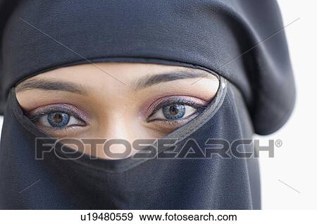 Stock Photo - Portrait of a young woman wearing a hijab. Fotosearch