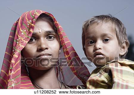 Stock Image - Portrait of a young woman with her son. Fotosearch