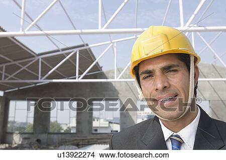 Portrait of an architect at a construction site View Large Photo Image Picture - Portrait of an architect at a construction site. Fotosearch