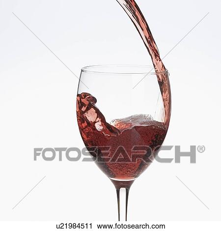 Red wine being poured into a wine glass View Large Photo Image Stock Image - Red wine being poured into a wine glass. Fotosearch