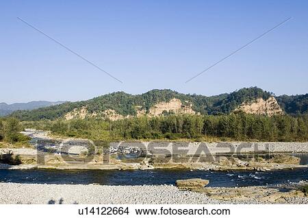 River in front of mountains, Jim Corbett National Park, Pauri Garhwal, Uttarakhand, India View Large Photo Image Picture - River in front of mountains, Jim Corbett National Park, Pauri Garhwal, Uttarakhand, India. Fotosearch