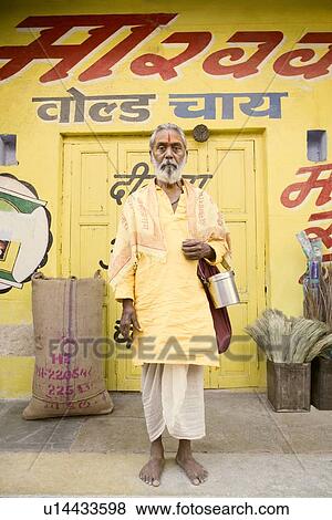Sadhu standing in front of a store View Large Photo Image Stock Photo - Sadhu standing in front of a store. Fotosearch