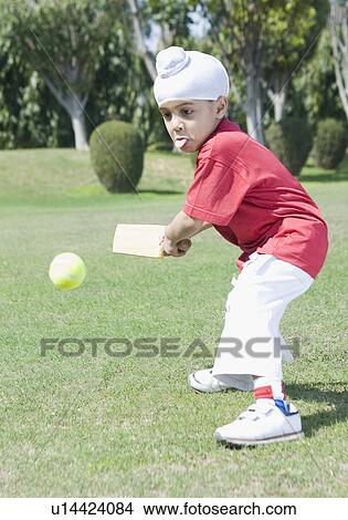 Side profile of a boy playing cricket View Large Photo Image Picture - Side profile of a boy playing cricket. Fotosearch