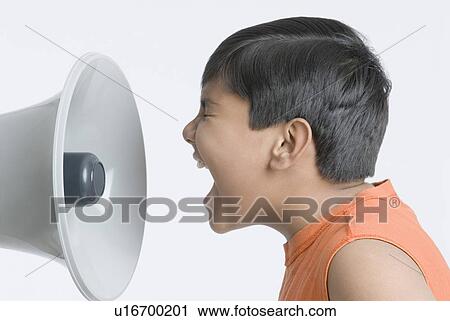 Side profile of a boy shouting into a megaphone View Large Photo Image Stock Image - Side profile of a boy shouting into a megaphone. Fotosearch