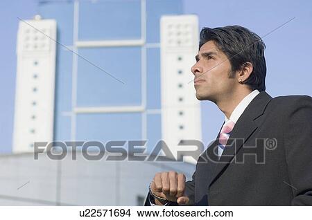 Side profile of a businessman looking up View Large Photo Image Picture - Side profile of a businessman looking up. Fotosearch