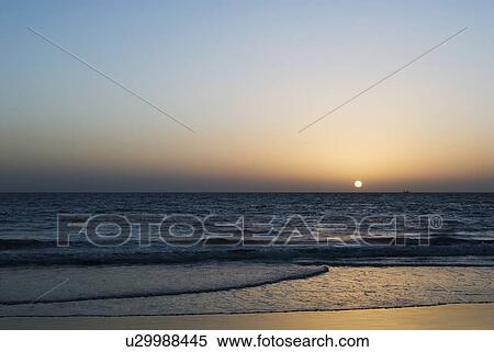 Sunset over the sea, Calangute Beach, Goa, India View Large Photo Image Stock Photography - Sunset over the sea, Calangute Beach, Goa, India. Fotosearch