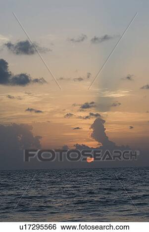 Sunset over the sea, Colva Beach, Goa, India View Large Photo Image Stock Photograph - Sunset over the sea, Colva Beach, Goa, India. Fotosearch