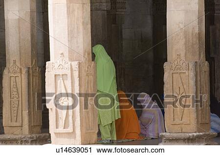 Stock Image - Three women in a mosque, Ajmer, Rajasthan, India. Fotosearch