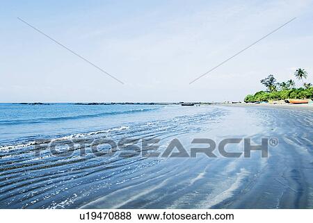Stock Photo - Waves on the beach, Morjim Beach, Goa, India. Fotosearch