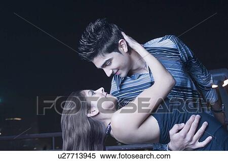 Young couple dancing and looking at each other View Large Photo Image Stock Photography - Young couple dancing and looking at each other. Fotosearch