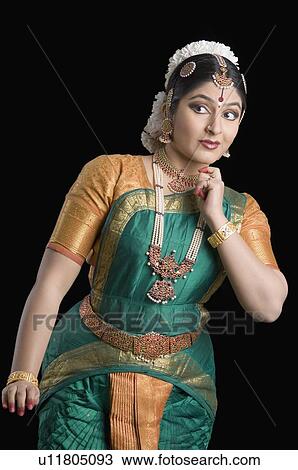 Young woman performing Bharatnatyam View Large Photo Image Stock Image - Young woman performing Bharatnatyam. Fotosearch