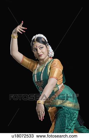Young woman performing Bharatnatyam View Large Photo Image Stock Image - Young woman performing Bharatnatyam. Fotosearch
