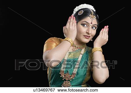 Young woman performing Bharatnatyam View Large Photo Image Stock Photo - Young woman performing Bharatnatyam. Fotosearch
