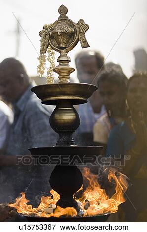 Close-up of a burning oil lamp, Tirupati, Tirumala Venkateswara Temple, Tirumala, Andhra Pradesh, India View Large Photo Image Stock Photo - Close-up of a burning oil lamp, Tirupati, Tirumala Venkateswara Temple, Tirumala, Andhra Pradesh, India. Fotosearch