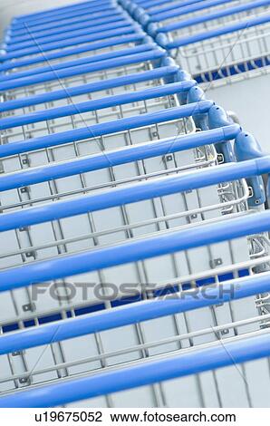 Luggage cart in a row View Large Photo Image Stock Image - Luggage cart in a row. Fotosearch