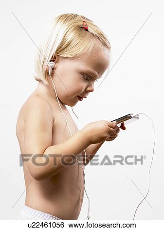 Girl listening to music on mp3 player View Large Photo Image Stock Photograph - Girl listening to music on mp3 player. Fotosearch