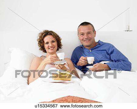 Portrait of man and woman in bed View Large Photo Image Stock Photo - Portrait of man and woman in bed. Fotosearch