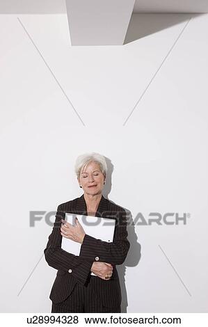 Stock Photo - Woman leaning back, closed eyes. Fotosearch