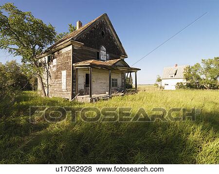Stock Photo - Abandoned farm house in rural field.. Fotosearch