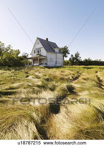 Stock Photography - Abandoned house in field. Fotosearch
