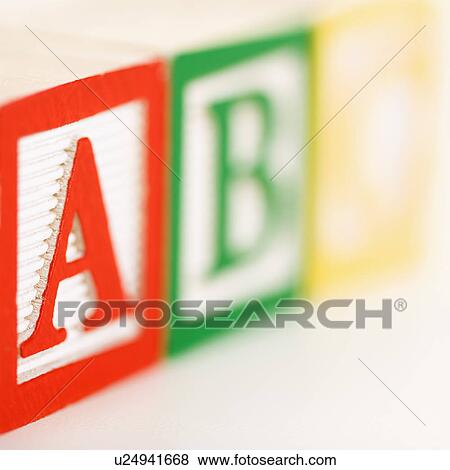 Stock Photo - ABC alphabet blocks lined up. Fotosearch