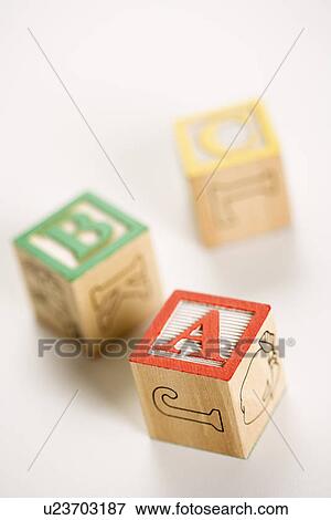Stock Photo - ABC alphabet blocks scattered on white background. Fotosearch