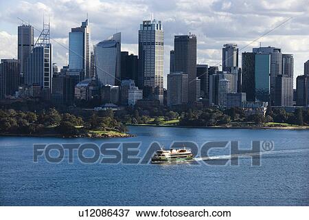 Aerial view ferryboat crossing harbour with skyline of Sydney, Australia. View Large Photo Image Stock Photo - Aerial view ferryboat crossing harbour with skyline of Sydney, Australia.. Fotosearch